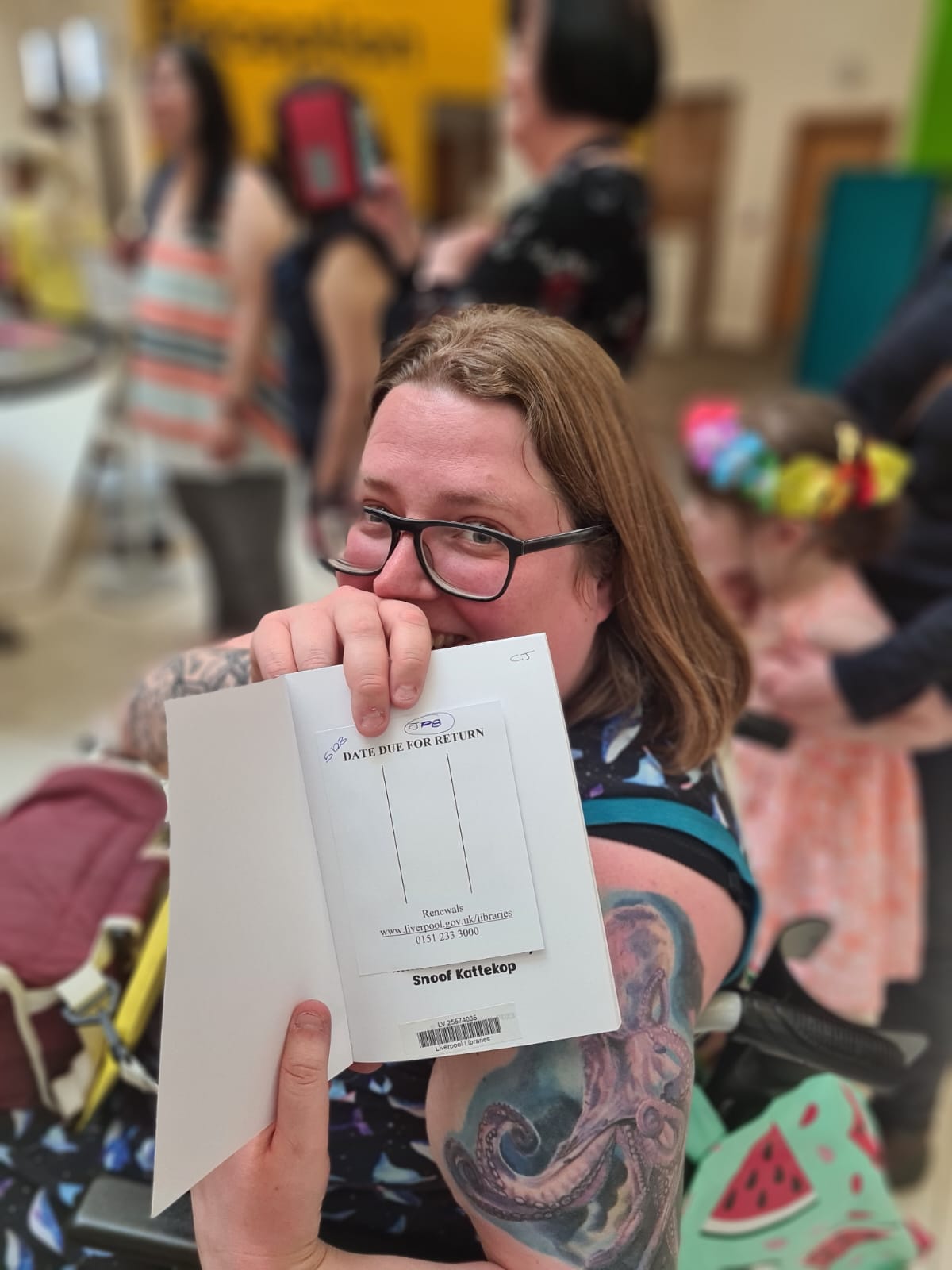 Snoof Snoof showing off her book