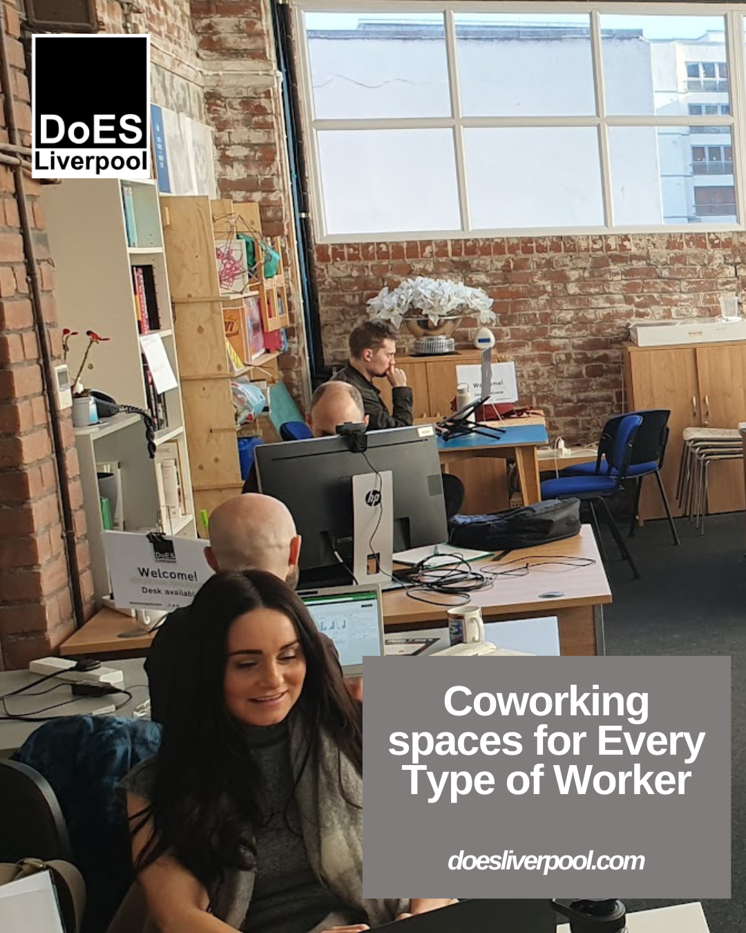 coworking at DoES Liverpool - the image shows 4 people sitting at desks