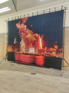 A huge latch-hooked rug featuring the Liverpool waterfront at night, with fireworks
